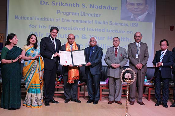 Group photo of Nadadur accepting a certificate