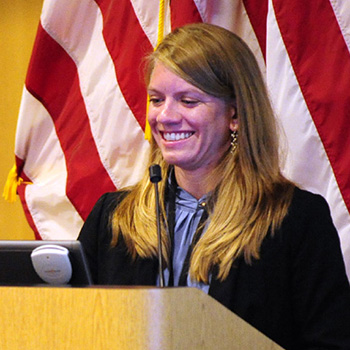 Rachel Krasich in front of a podium