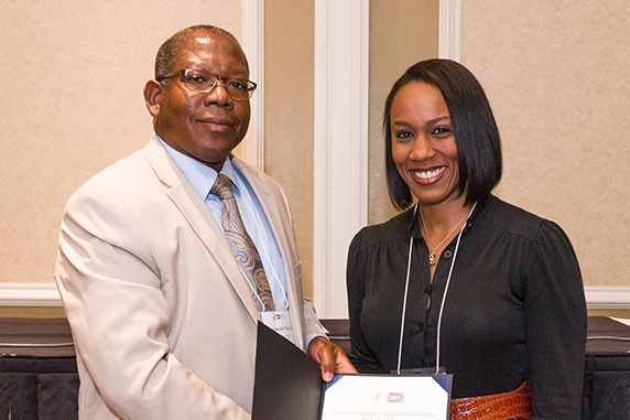 McWhorter, right, accepted her award from Lincoln Edwards, D.D.S., Ph.D., president of Northern Caribbean University and chair of the NMRI planning committee.