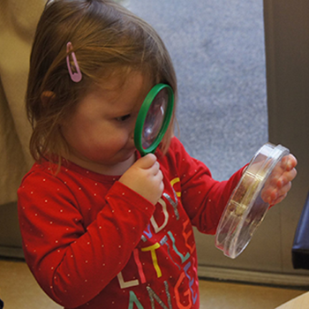 Handling petri dishes and magnifying glasses is routine at the learning center, which helps develop an early love of scientific inquiry in its young clients. 