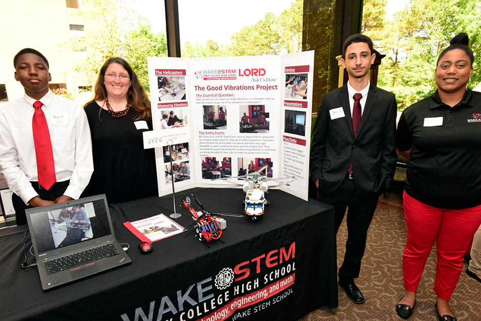 Teachers from Wake STEM Early College High School visited the LORD Corporation, then worked with their students to solve vibrational problems caused by helicopter motors. 