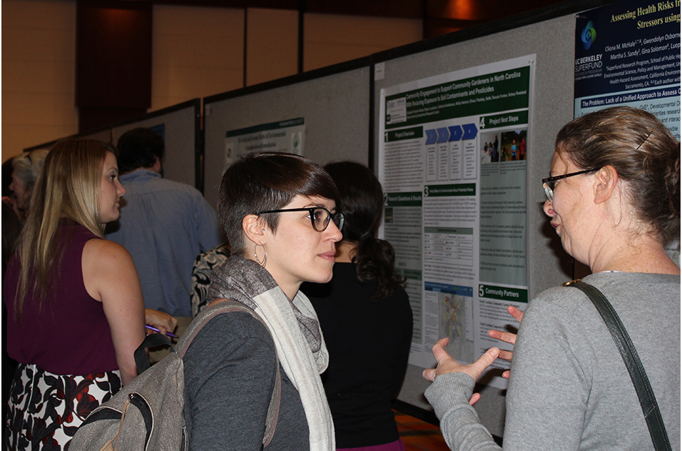 Attendees discuss research
