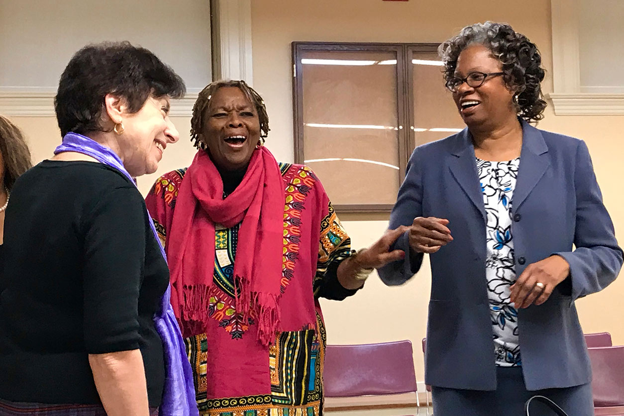 Linda Birnbaum laughs with Thelma Jones and Lucile Adams-Campbell