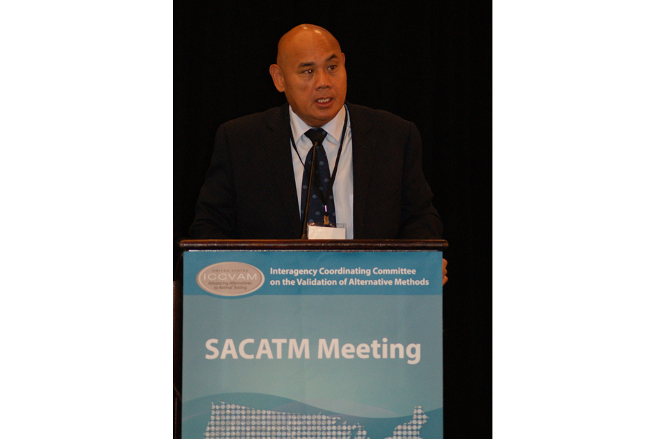 Danilo Tagle, Ph.D. at podium of SACATM Meeting