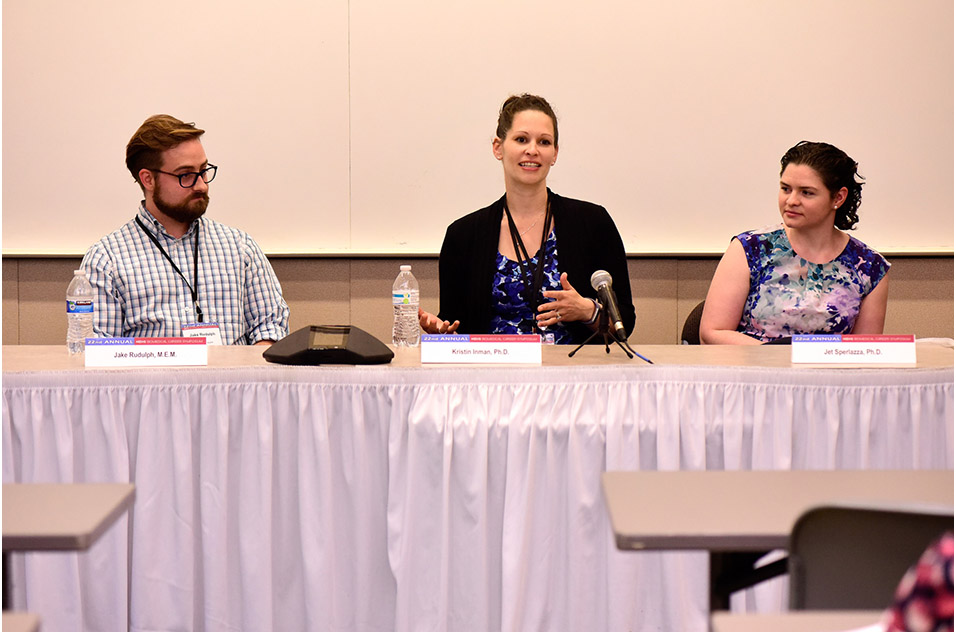 A group of speakers in a panel discussion during the event