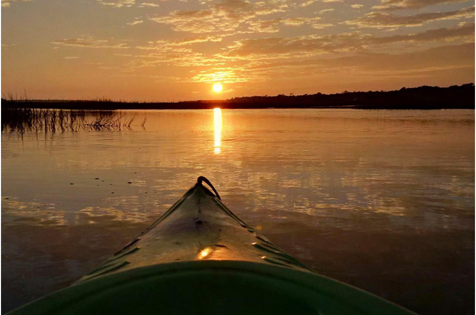 kayak on the water at sunset