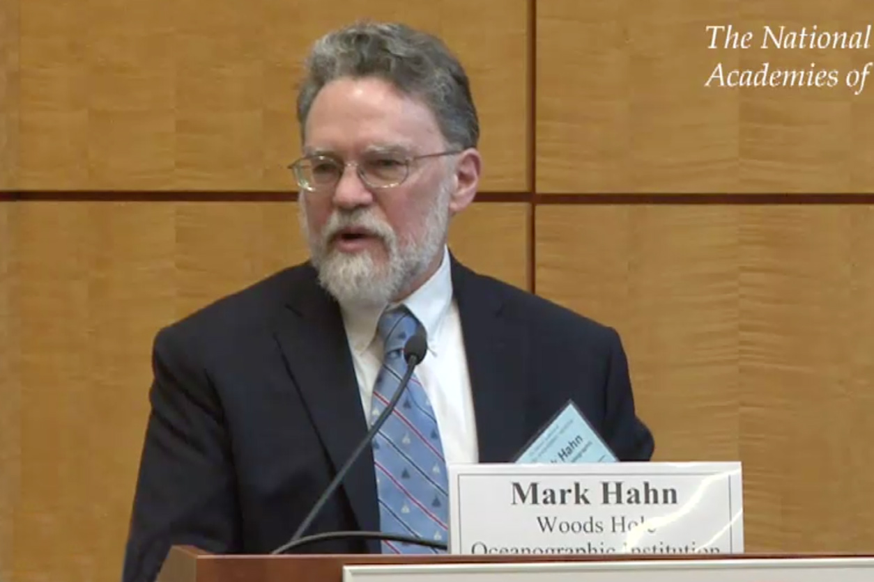 Mark Hahn, Ph.D., Woods Hole Oceanographic Institution, stands at podium