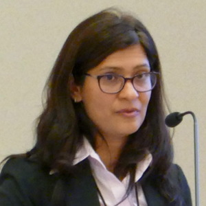 Mamta Behl, Ph.D. speaks at microphone