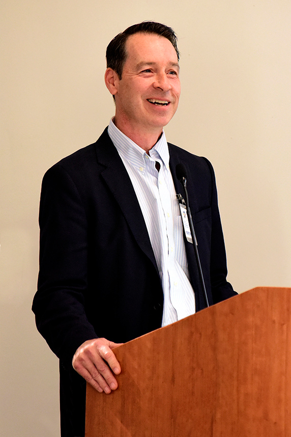 Peter Tontonoz, M.D., Ph.D. smiles at podium