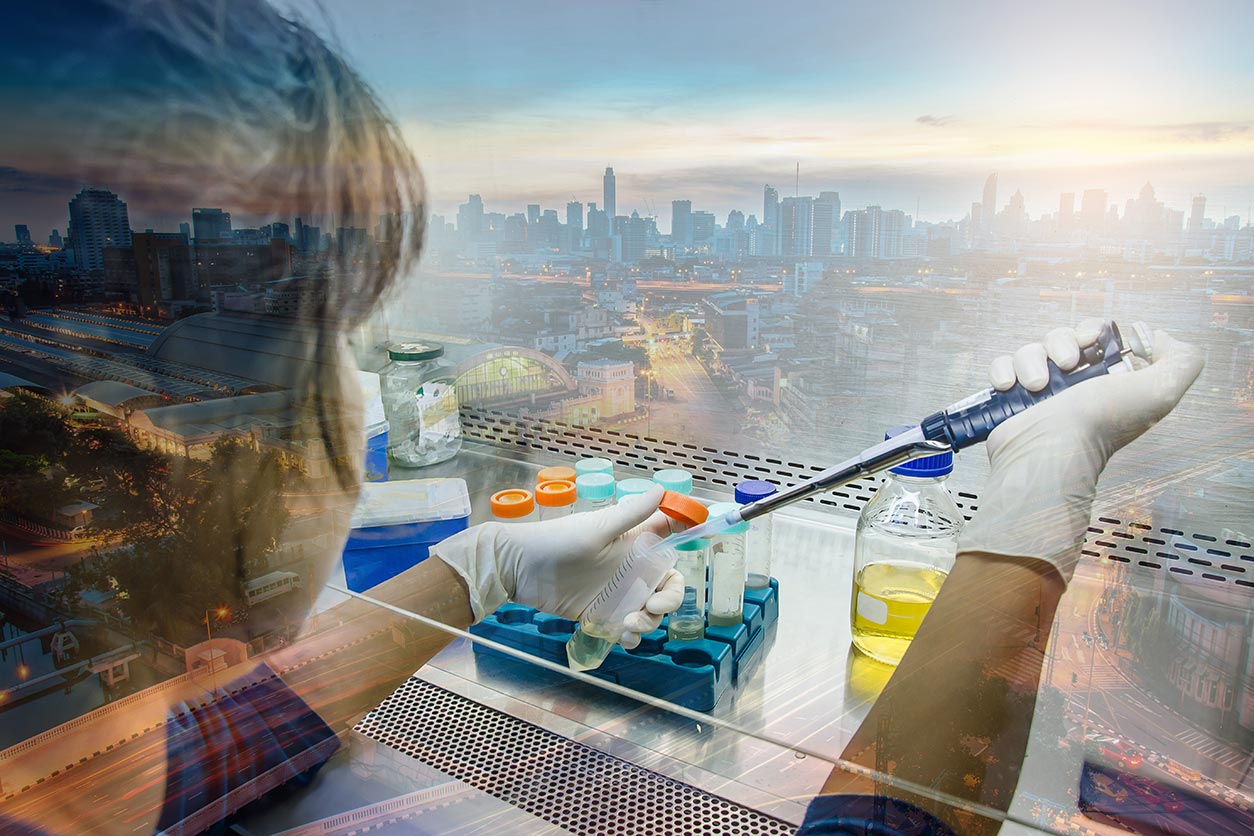cityscape and women handling chemicals in a lab