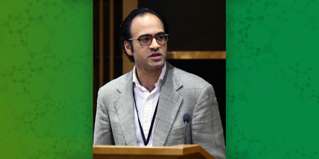 Chirag Patel, Ph.D. stands at podium