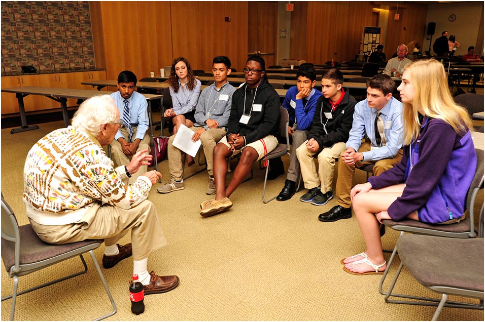 Oliver Smithies, D.Phil. speaks with a group of local high schoolers