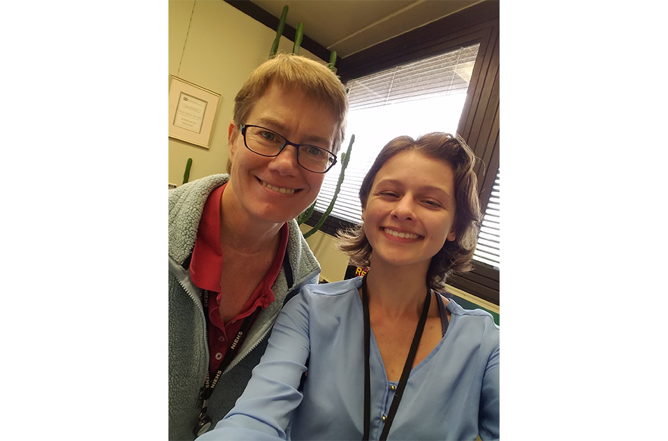 Two scientists pose for a selfie