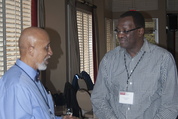 Pierre Bushel, Ph.D., spoke with Tyson, left
