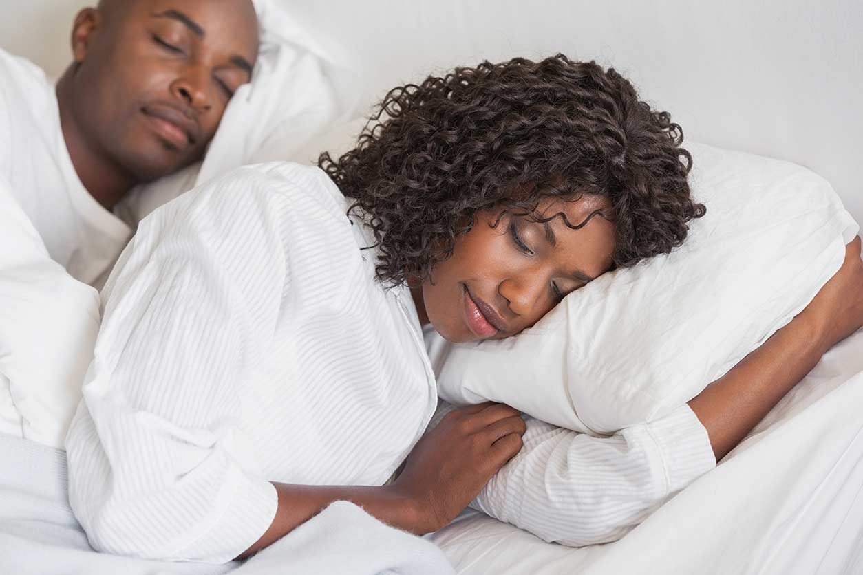 man and woman sleeping peacefully