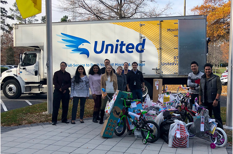 volunteers in front of truck