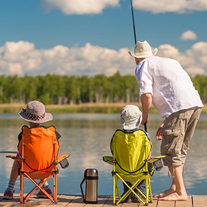 A family fishing on a dock