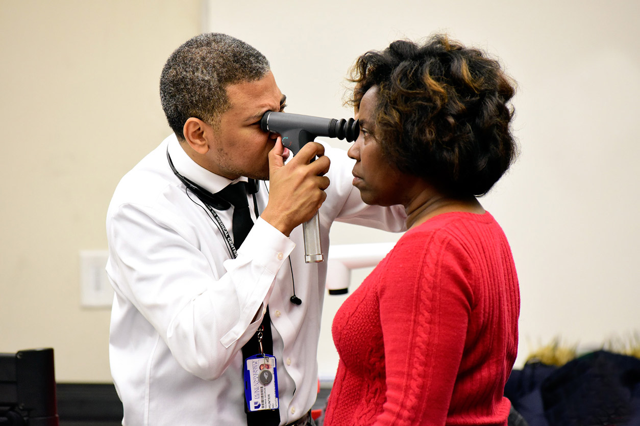 Thomas Hunter, M.D., Duke University Health System doing glaucoma check