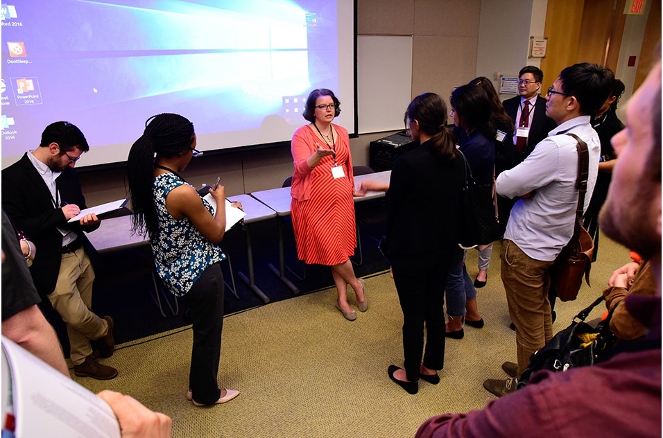 Lori Conlan speaking with a group of attendees