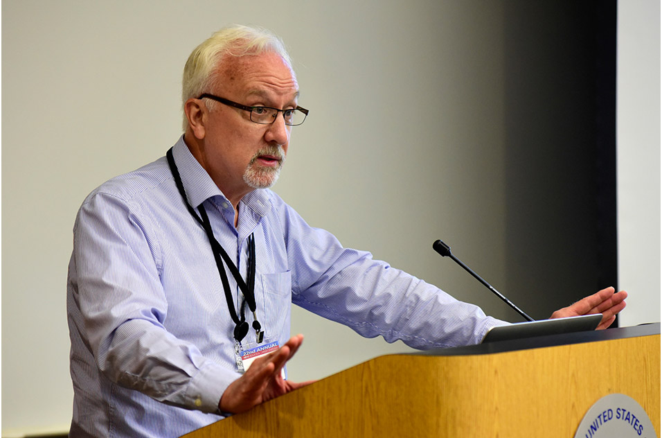 Paul Doetsch speaking to the attendees at the podium