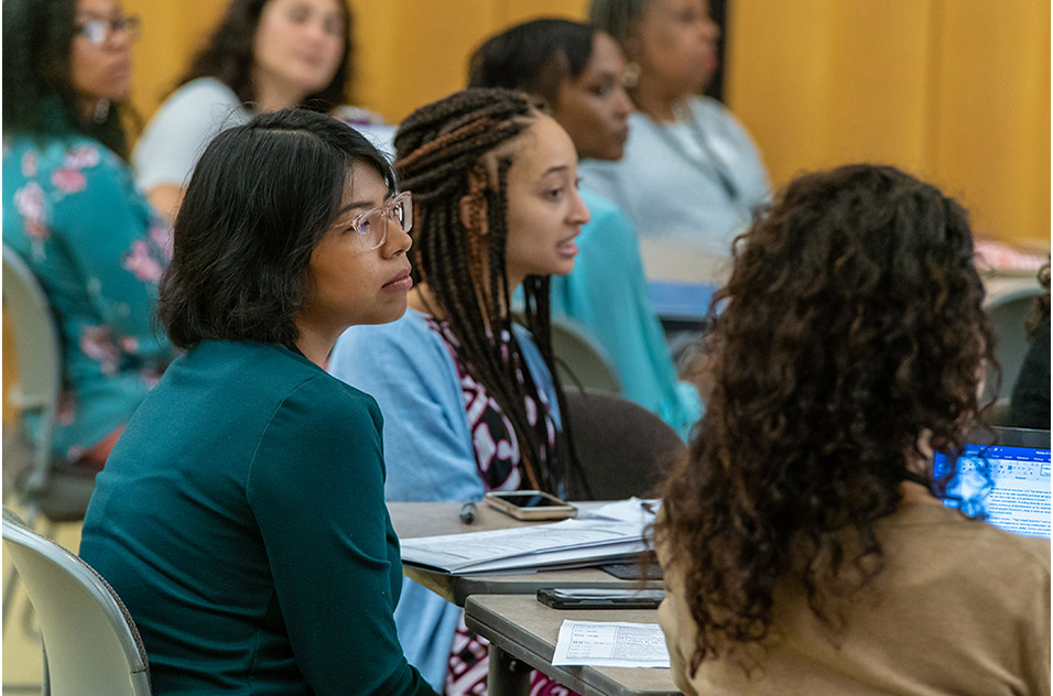 Alma Solis and Sierra Atwater listening during the program