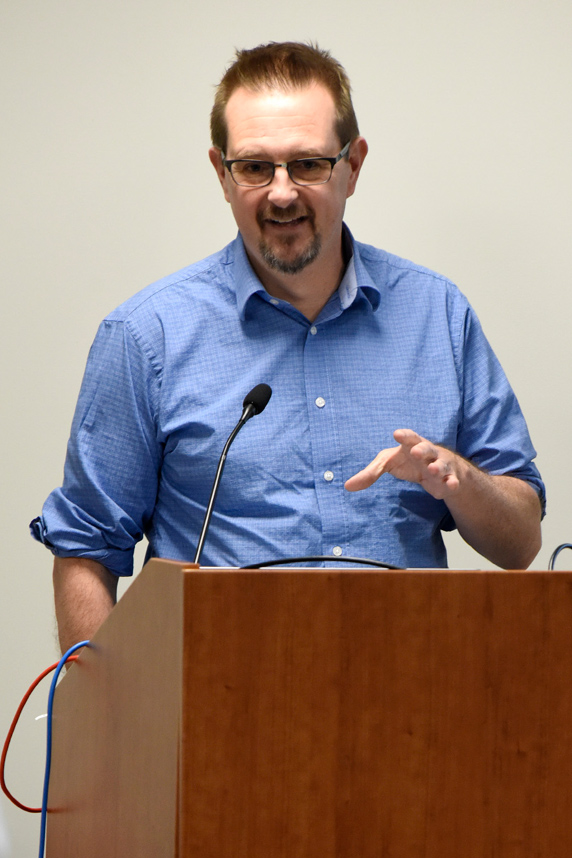 Scott Auerbach, Ph.D. at podium