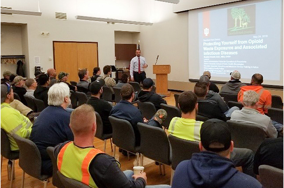 attendees watch presentation of Protecting Yourself from Opioid Waste Exposures a nd Associated Infectious Diseases