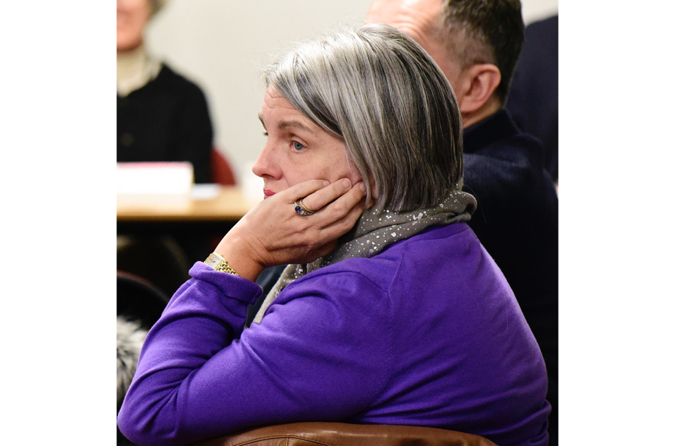 Elizabeth Stewart, M.D. in profile, holding head with left hand