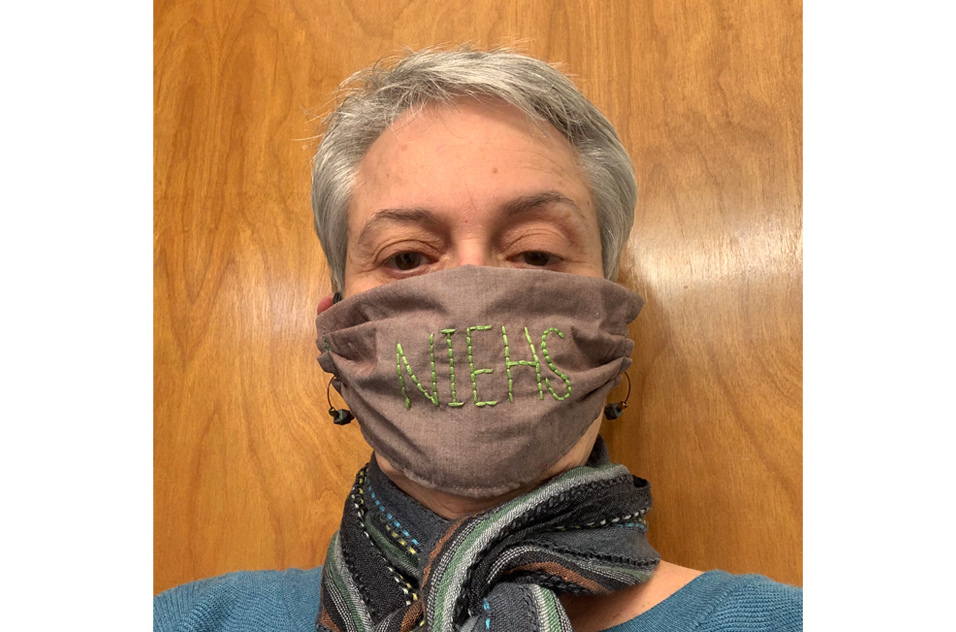 Gwen Collman, Ph.D. models a mask