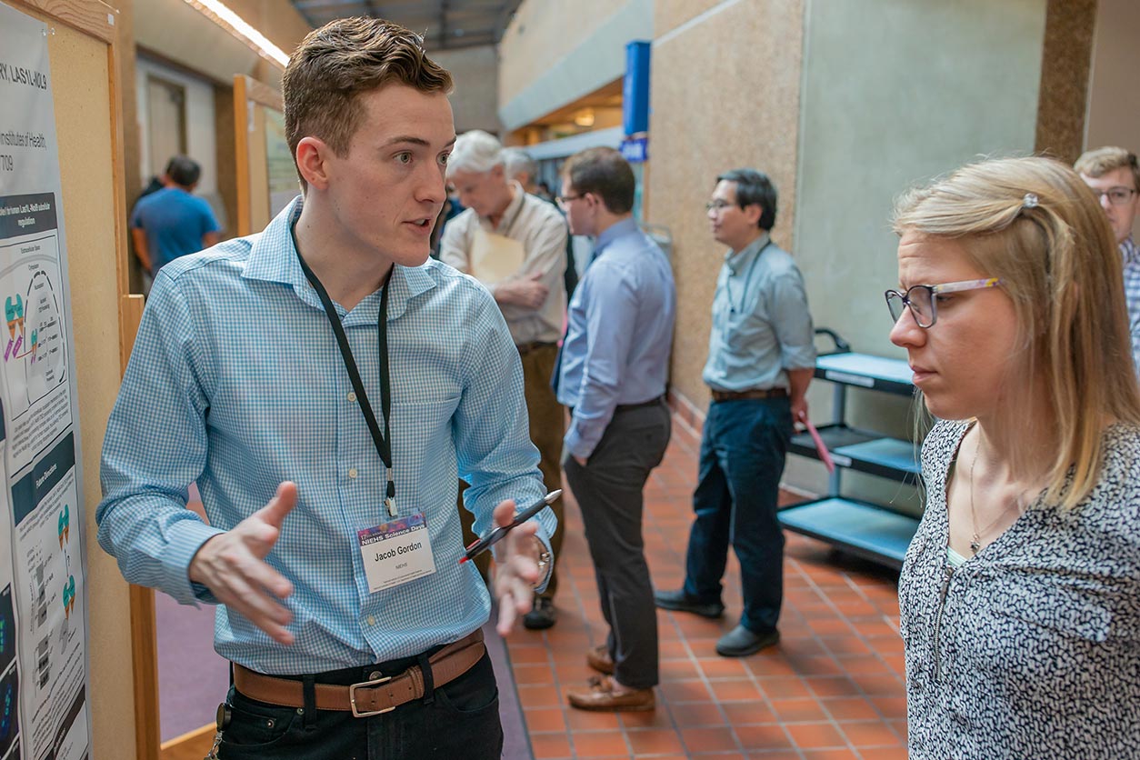Jacob Gordon standing by poster at 2019 NIEHS Science Days
