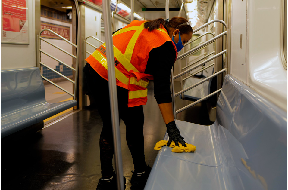 person cleans a subway car, NYC