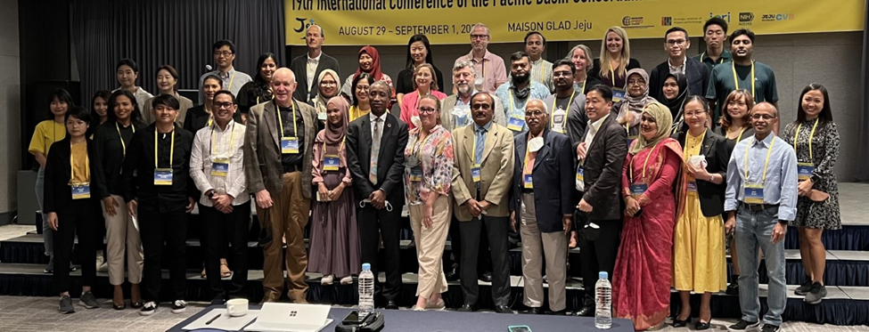 Conference speakers and moderators representing more than 30 institutes, organizations, and universities, pose for photo.