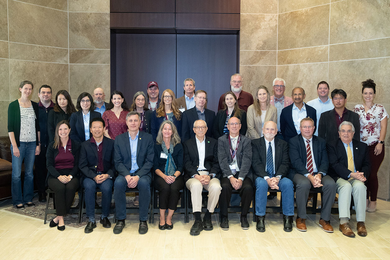 group photo of members of the Texas A&M University Superfund Research Center and NIEHS’ Michelle Heacock, Ph.D., and Director Woychik.