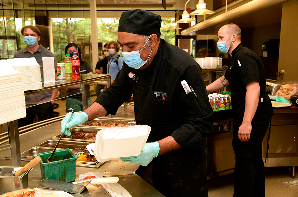 Chef Julius Enoch prepares a to-go plate