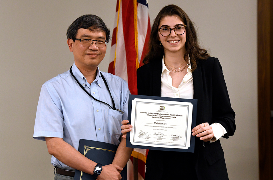 Steven Wu, Ph.D., a staff scientist in the Pregnancy and Female Reproduction Group, left, and NSCP scholar Skylar Montague Redecke, right.
