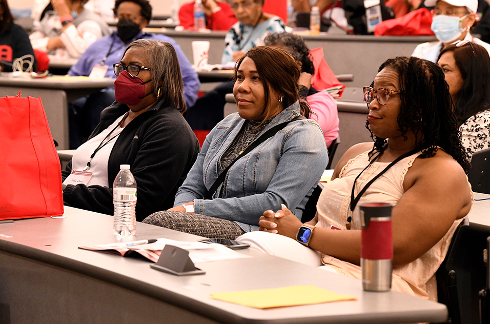 Women sitting in the audience at the conference