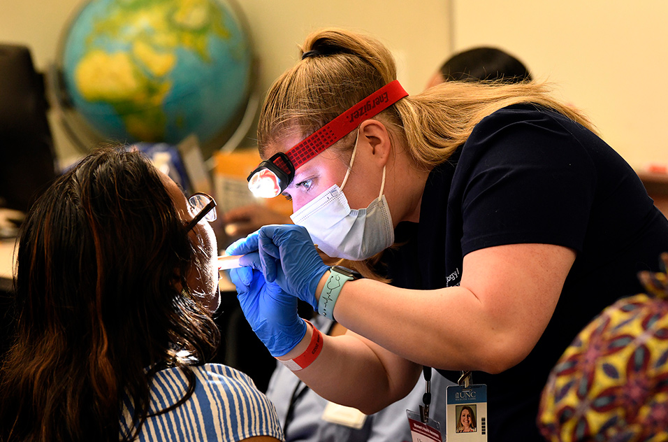 Dentist checking attendee