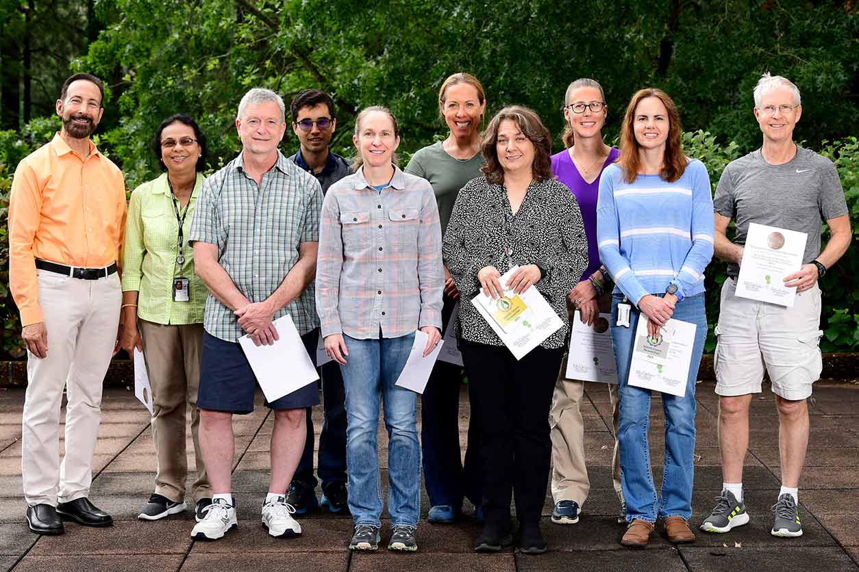 Zeldin poses for a photo with Green Labs awardees