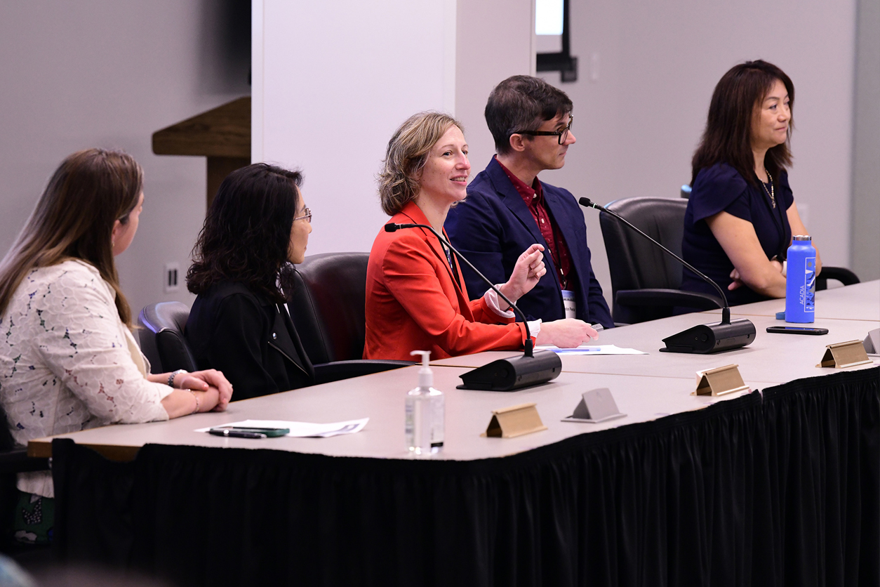 Patricia Opresko, Ph.D. centered by 4 other panelists