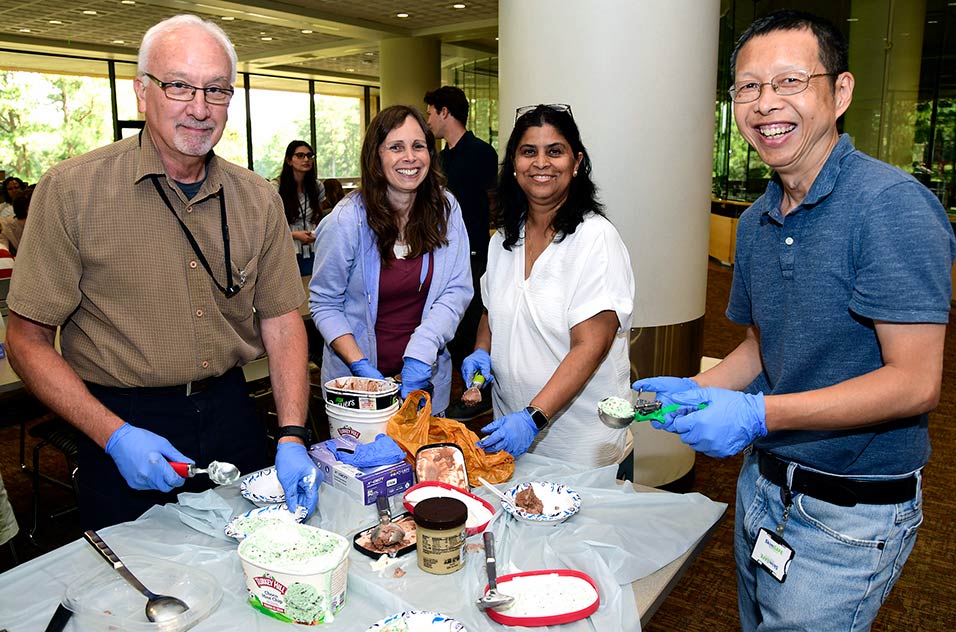 From left to right: Paul Doetsch, Ph.D., deputy scientific director; Michelle Campbell, a biologist in the Environmental Epigenomics and Disease Group; Suchandra Bhattacharjee, Ph.D., undergraduate research training program manager; and Hong Xu, Office of Fellows' Career Development program manager and data analyst; scooping ice cream to celebrate a successful summer.