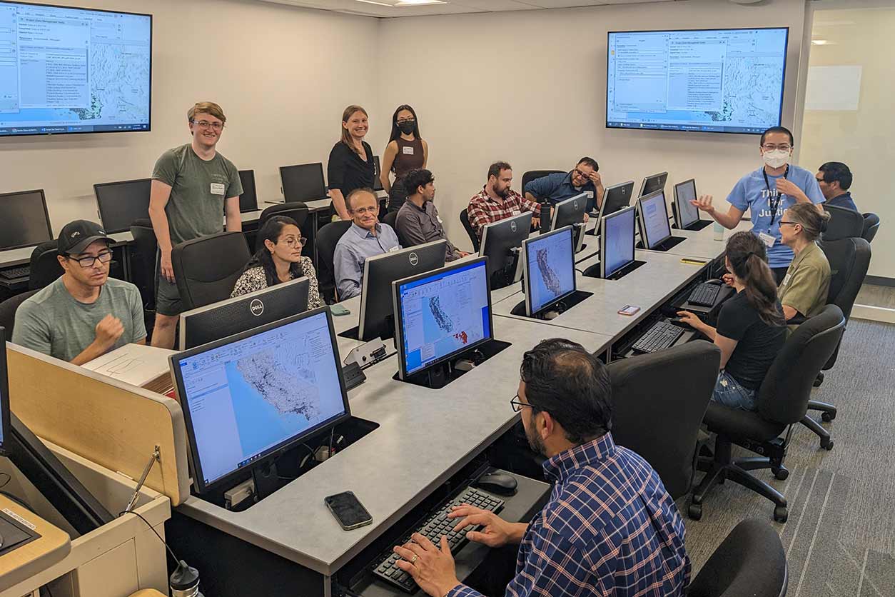 Clare Pace, top row second from right, and Tien Tran, far right, co-presented a workshop on the Drinking Water Tool at the Climate and Environmental Justice Conference hosted by Santa Clara University in April 2023.