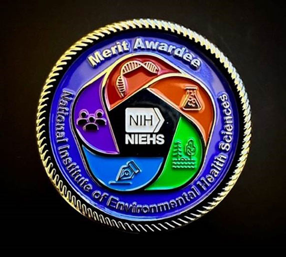 The new merit award medallions feature the NIEHS logo on the front with the specific award citation engraved on the back.
