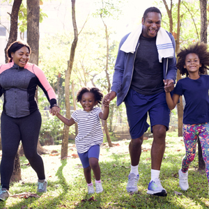 African-American family exercising outdoors