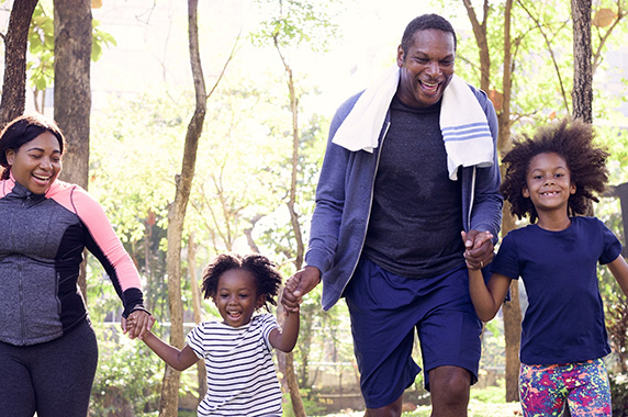 African-American family exercising outdoors