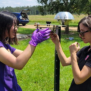 Jennifer Richmond-Bryant, Ph.D., right, and Chuqi Guo, Ph.D., left, set up measurement devices in Colfax