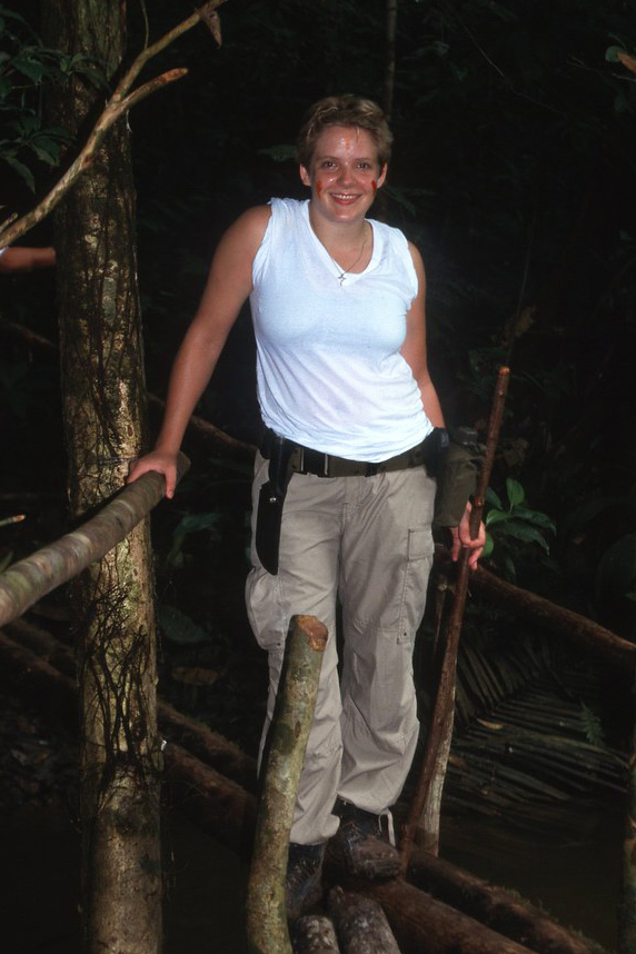 Cassandra Quave, Ph.D. standing in the jungle