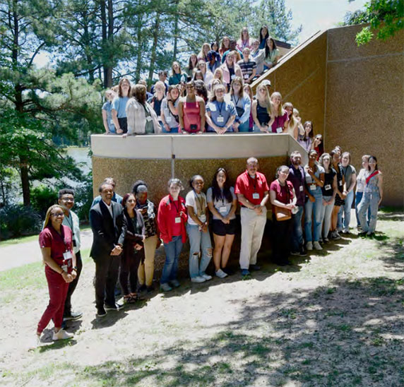 More than 50 NC State veterinary students gather for a group photo before heading to lunch in the cafeteria. (Photo courtesy of David Iversen / NIEHS)