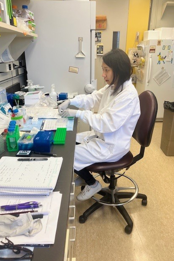 Yu-Ying Chen., Ph.D. sitting in her lab