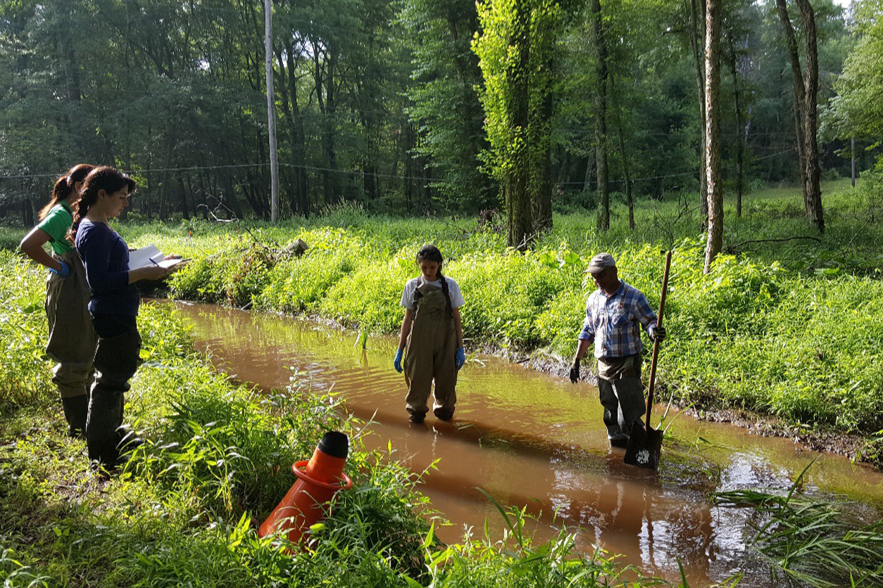 Ghosh and team standing in the river