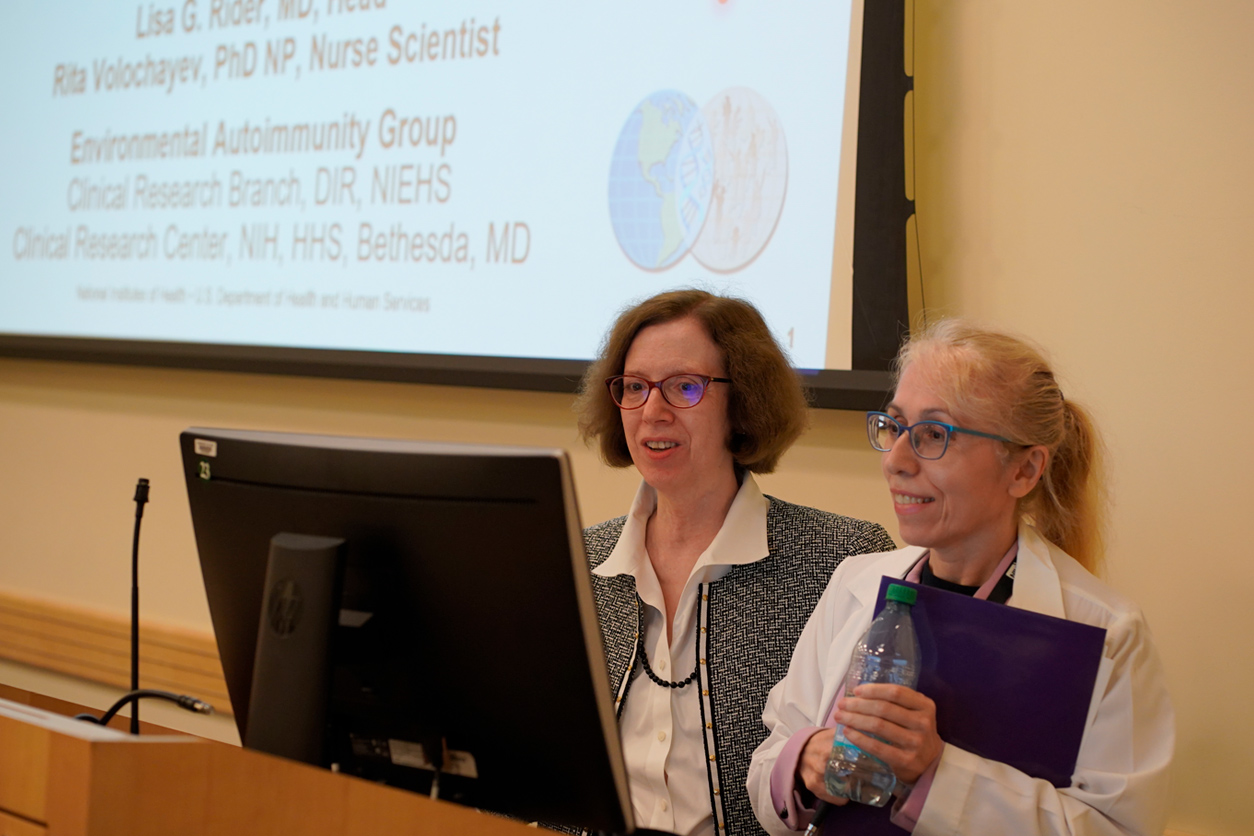 Lisa Rider and Rita Volochayev at podium